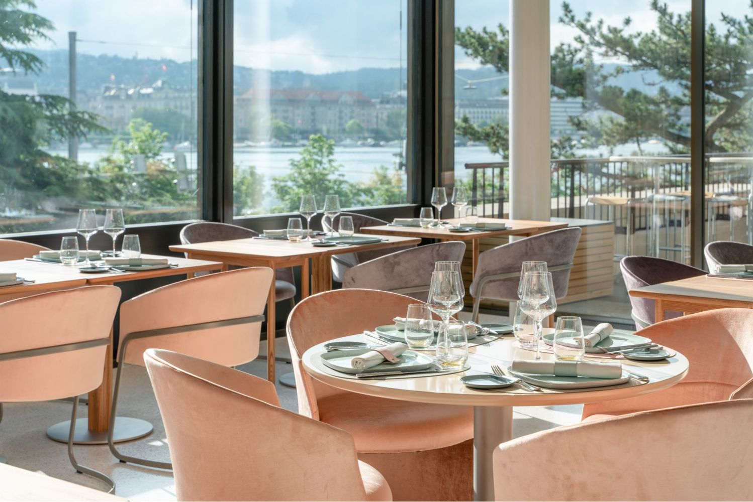 Elegantly furnished restaurant with an exclusive ambience and lake view.